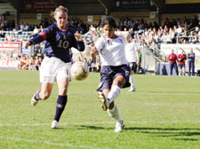   Scotland striker Julie Fleeting (left) takes on Arsenal colleague Mary Philip 