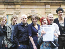 Kendall O’Neill, Divya Ahluwalia, Emma Violet, Stuart Cox, Ollie Grove, Gilliam Roy and Malcolm Salomon with the petition calling for the Middlesex Hospital site plan to be scaled down 