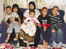 Mr Maslah’s grieving widow Sahra and the couple’s five children at their Kentish Town home  