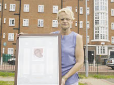 Silla Carron with a memorial poster to Wayne made by ex-colleagues