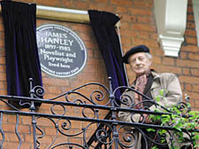 James Hanley's son Liam next to his father's plaque 