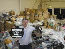 Chief Trading Standards officer Christopher Jones with the items, following the Camden swoop 
