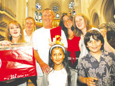 St Paul’s head John Wilkinson with past and present pupils at St Mary’s church.  