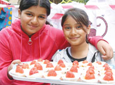 Sharmin Rashid and Tasfia Sufi enjoy a sweet taste of the Caribbean at the cake stall