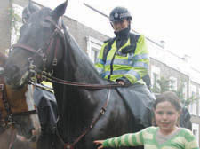 Lauren Cawley meets Charlotte the police horse at the Alma Street summer fair.