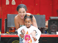 Trinity  Daniel-Adesokan trying out circus toys with mum Yvette Daniel