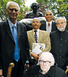 Indian Attorney General Milon Banerjee, front left, with members of the India League and its president Michael Foot