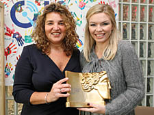 Jo Shuter, left, displays her Headteacher of the Year award alongside the X Factor’s Kate Thornton
