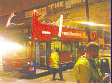 The severely damaged No 24 bus after it hit the railway viaduct in Prince of Wales Road