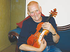 Passionate musician George Holt has continued to play the violin during his battle against cancer