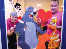 Tamar Lazarus and Rob Salter add a little colour to the children's playroom at the Royal Free Hospital