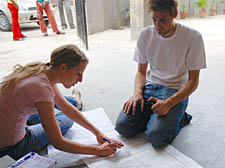 Toni Fryer and Steve Choun working on the street map of the Ambedka Camp