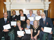 Town Hall honours: Back row, from left: Professor Mike Wren MBE, David Nasmith-Miller MBE, Dame Ann Leslie, John and Moira Doneo MBE; front row: Rosemary Rice MBE, Professor Jonathan Drori CBE, Mayor of Camden Councillor Dawn Somper and Edward Posey OBE
