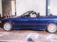 Asha Jihu in the expensive BMW that was destroyed while she was overseas caring for her sick father