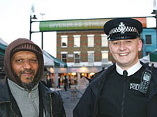 Stallholder Yusuf Mohammod with PC Lee Janes in Inverness Street