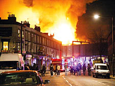 The scene from Camden High Street on Saturday night, where dozens of people looked on in horror at the scale of the blaze
