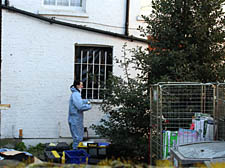 Forensic experts continued searching a house in Kilburn this week
