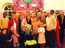 Mary Christodoulou with colleagues, friends, family and children at the Coram&rsquo;s Fields nursery