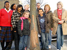 Eleanor Botwright (second from right) with staff and community centre members beside the damaged tree