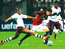 Abou Diaby tackles Kaka during Arsenal’s historic win over AC Milan in the Champions League 