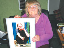 Betty Austin with a photograph of her son Michael 