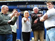 Pictured (from left): Gordon Baileys, Dennis and Amanda McNulty and Philip Bamford 'fire' landlord Richard Wooderson
