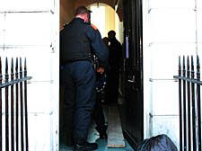 Police officers raid the Camden Road property