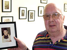St Michael's Church guardian Peter Deed with a picture of former Camden Town priest Father Alan Page provided by a New Journal reader