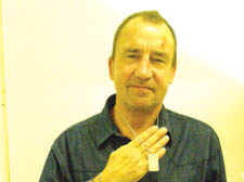 Lenny Rodgie shows the ID tag that would provide crucial information to those coming to his aid in the event of a seizure