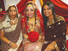 Bride Rehala Begum (centre) flanked by friends at the ceremony ay the Irish Centre   