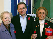 Joan Colegate, her son John, and war veteran Pam Nenk collecting for the Poppy Appeal at the O2 Centre