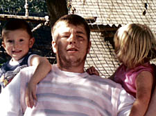 'Barney' Kennnedy playing with his children Bailey and Bethany