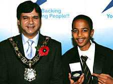 William Ellis School pupil Ahmed Sharif receives his award from the Mayor 
