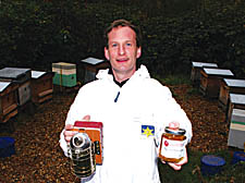 Toby Mason shows off his exclusive honey, which is produced in the Inner Circle of Regent's Park