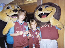 Patrick and Stanley with Aston Villa mascots Bella and Hercules.