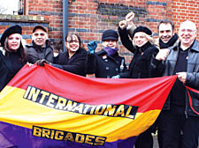 The family of Bob Doyle fly the International Brigades' colours at his funeral. From left: Jessie, Tabby, Margarita and Joelle Doyle, Judd Charlton, and Bob and Julian Doyle