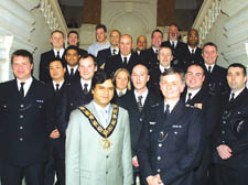 Nurul Islam and police Borough Commander Dominic Clout with the award-winners at the town hall