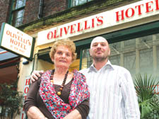 Angela and Domenic Spina outside Olivelli's restaurant and hotel in Store Street, Bloomsbury