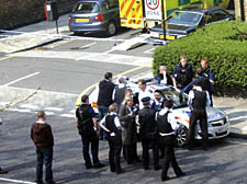 Police, including forensic teams, at the scene of the shooting in Roderick Road, Gospel Oak, yesterday morning