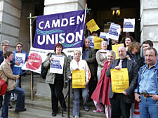 Campaigners who are fighting the sale of Camden Council&rsquo;s housing stock make their point outside the town hall