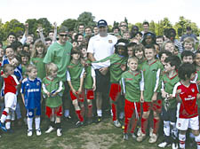 Regents’s Park FC head coach John McCulloch with the club’s other coaches and its young players who will link up with West Ham