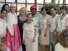 Centre manager Nancy Rasool, pictured fourth from left, celebrates with Ash Court care staff wearing traditional clothes from their countries of origin including South Korea and the Philippines