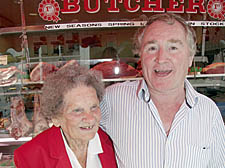 Hilda Sefton celebrates her retirement at the age of 95 with Barrett’s butchers owner Bob Enwright