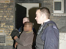 Police empty the raided house in Vine Hill off Clerkenwell Road
