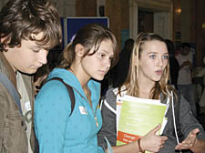 Acland Burghley pupils (left to right) Luke Woollard, 14, Sonia Paganuzzi, 15, and Hattie Brock, 15, get in some early questions before the great inquisition proper starts in Camden&rsquo;s Council Chamber