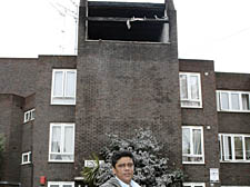 Sheikh Salam outside the wrecked flat on the top floor