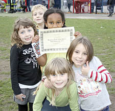 Talent show winner Ebise Debella, aged eight, holding her certificate with Mitchell Cole, six, behind her and (left to right) Abby Lowne, also six, Jade Brionne, seven, and Chloe Hayes, also seven