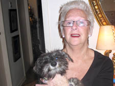 Supermarket worker Barbara Holden at home with her dog Oscar  