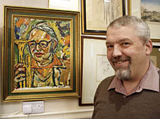 Colin Smith of Hampstead Art Auctions with the portrait of Humphrey Lyttelton