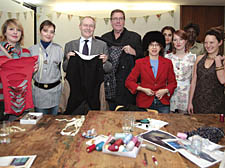 Council leader Keith Moffitt and environment chief Cllr Chris Knight help eager celebrity clothes recyclers. Left and right, some examples of revamped cast-offs from the famous